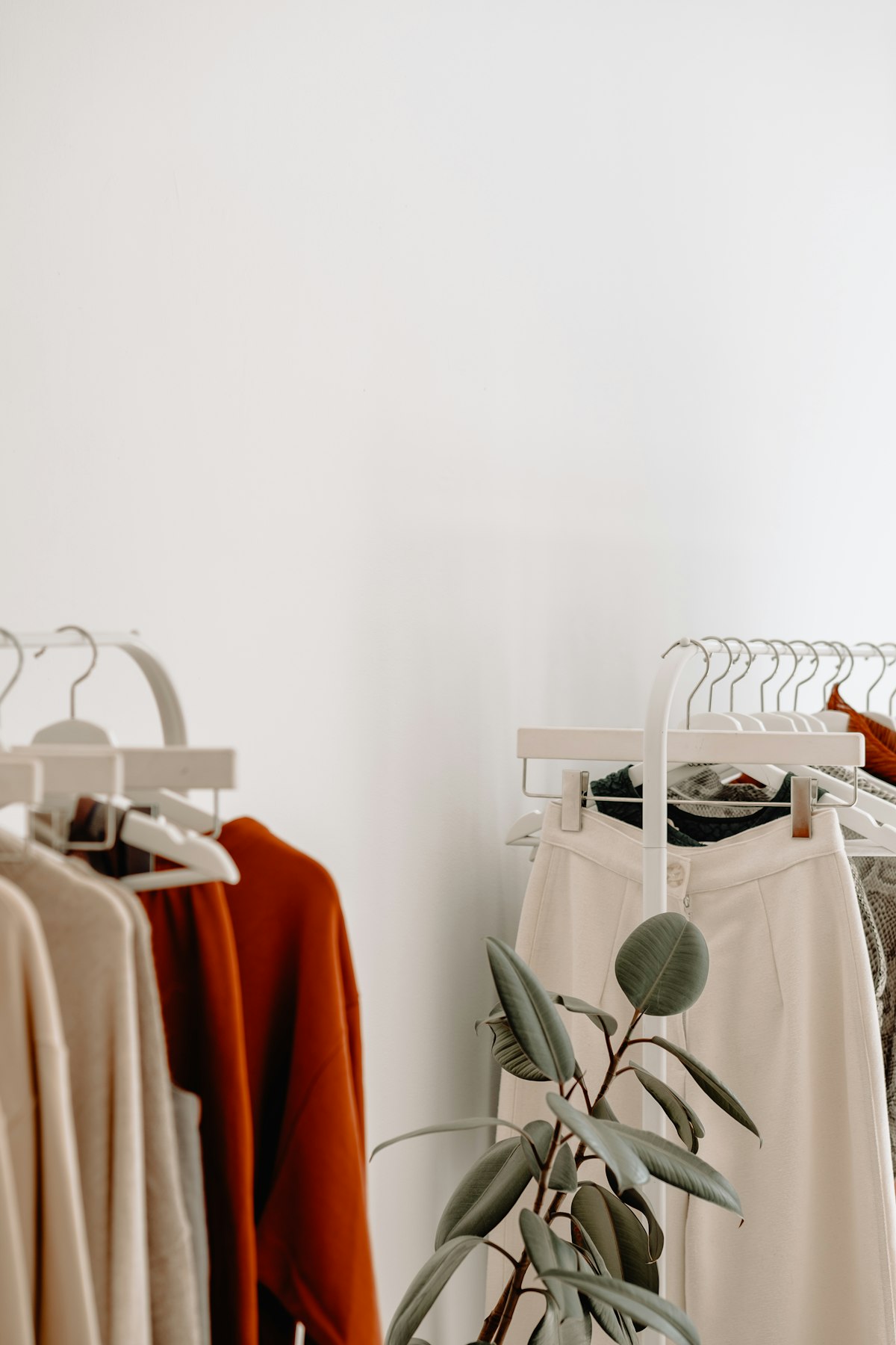 Classic tailored coat hanging as a wardrobe outerwear essential